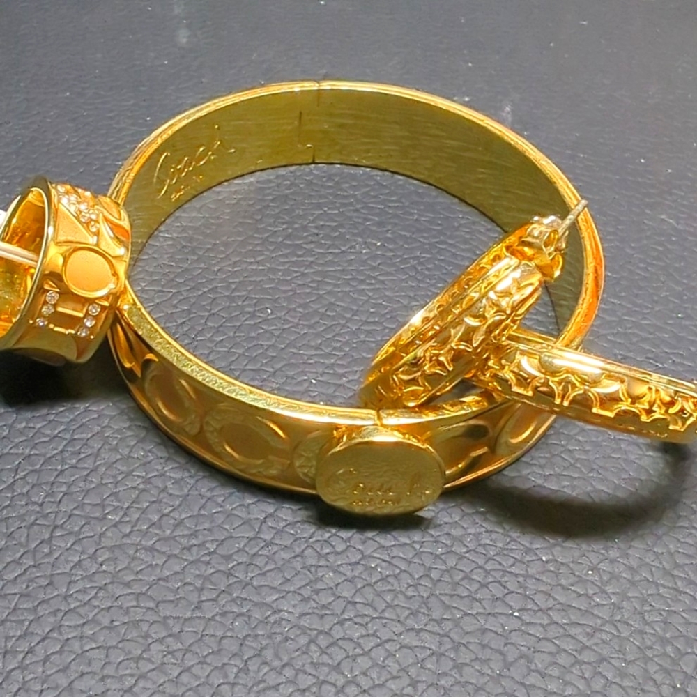Set of Coach ring, earrings, and bangle bracelet